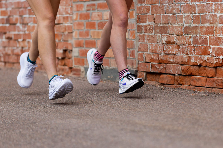 A couple running with Roadrun socks