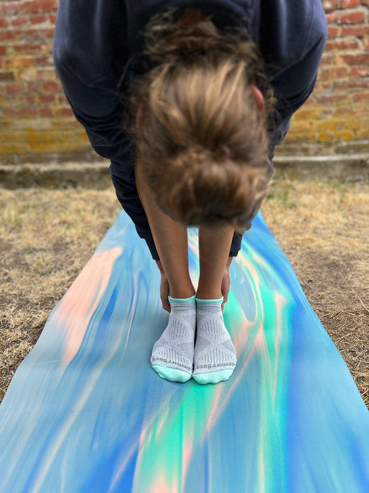 Woman wearing no blister yoga socks