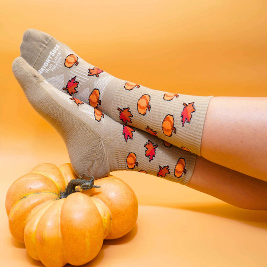 Run Luxe socks, Crew length, Brown with fall leaves and pumpkin logos.