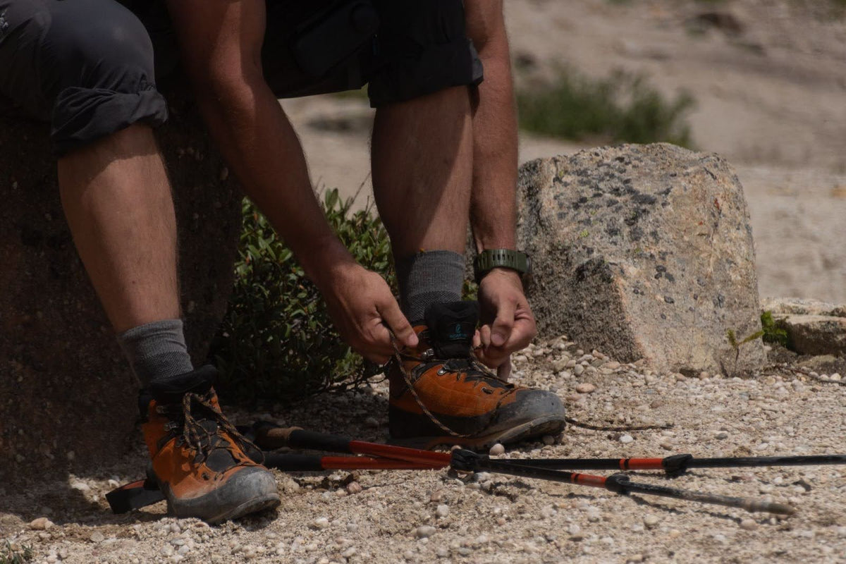 man tying boot laces