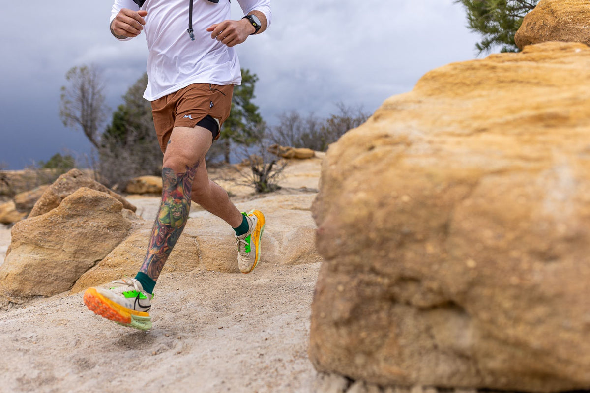 man running on a rocky trail