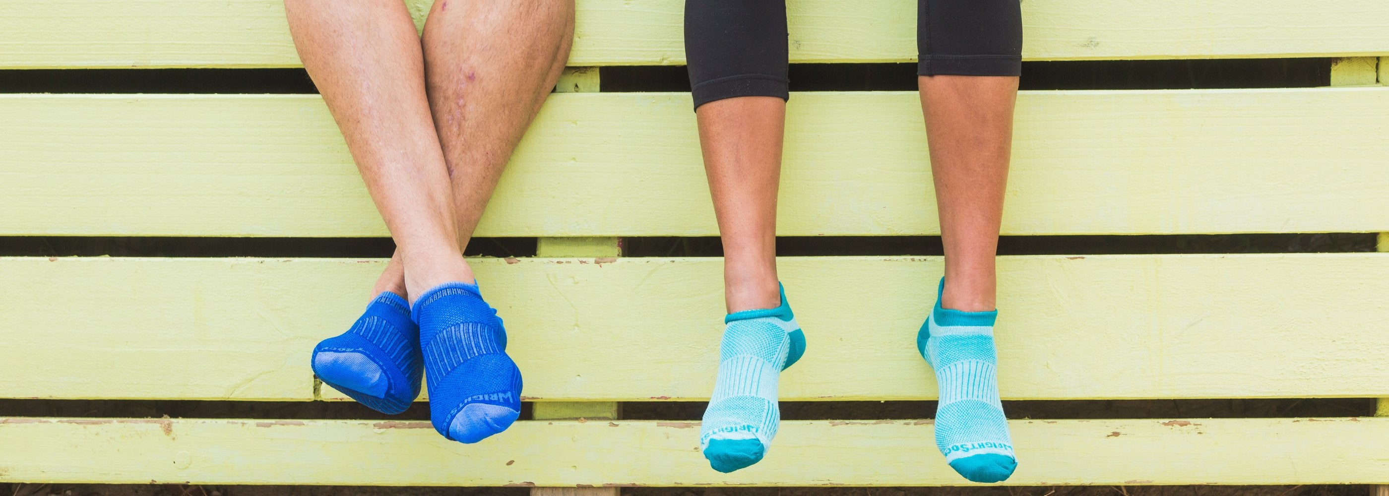 woman tying shoes with blister free socks
